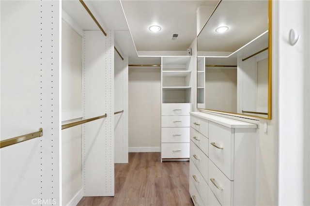 walk in closet featuring visible vents and light wood-style flooring