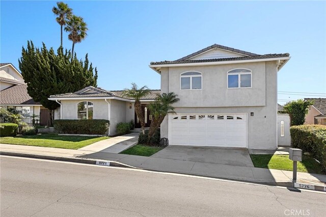 5726 Sunmist Dr, Rancho Palos Verdes, CA 90275 - view of front facade with an attached garage, stucco siding, concrete driveway, and a tiled roof