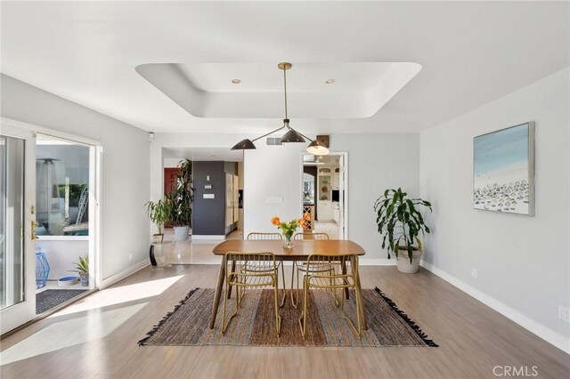 5726 Sunmist Dr, Rancho Palos Verdes, CA 90275 - dining space with a raised ceiling and wood finished floors