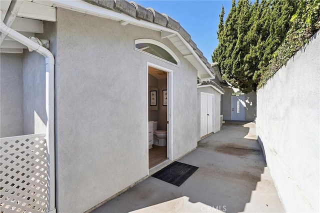 5726 Sunmist Dr, Rancho Palos Verdes, CA 90275 - doorway to property with stucco siding and fence