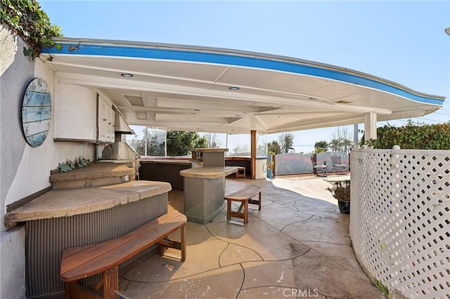 view of patio / terrace featuring a hot tub