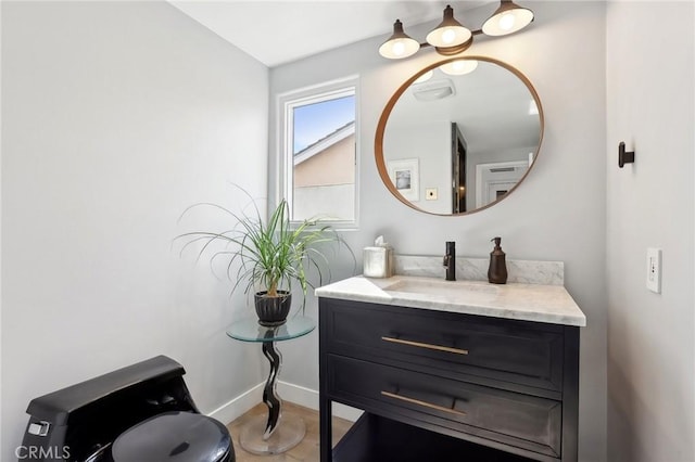 bathroom with vanity and baseboards