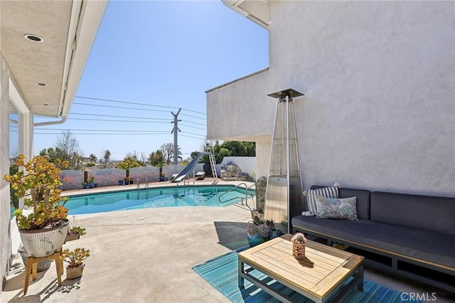 5726 Sunmist Dr, Rancho Palos Verdes, CA 90275 - view of swimming pool with a water slide, a patio area, an outdoor hangout area, and a fenced backyard