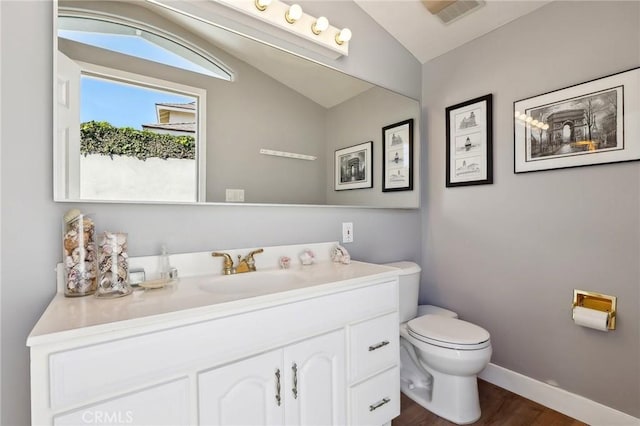 5726 Sunmist Dr, Rancho Palos Verdes, CA 90275 - half bathroom featuring lofted ceiling, toilet, wood finished floors, vanity, and baseboards