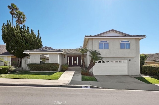 5726 Sunmist Dr, Rancho Palos Verdes, CA 90275 - mediterranean / spanish-style home with stucco siding, an attached garage, a tiled roof, and driveway