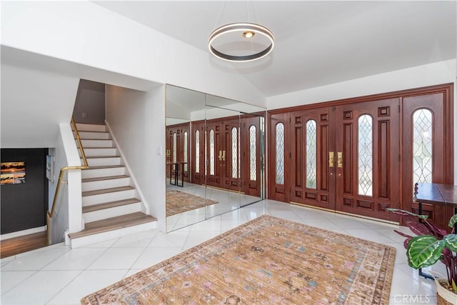 5726 Sunmist Dr, Rancho Palos Verdes, CA 90275 - foyer with tile patterned flooring, stairway, and lofted ceiling