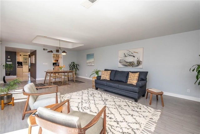 5726 Sunmist Dr, Rancho Palos Verdes, CA 90275 - living area with baseboards, wood finished floors, and a raised ceiling