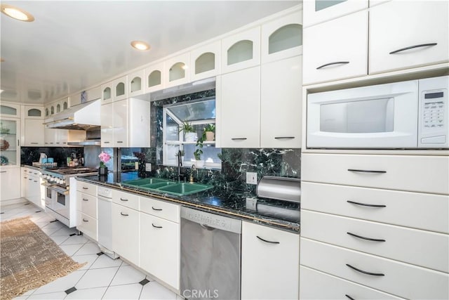 5726 Sunmist Dr, Rancho Palos Verdes, CA 90275 - kitchen featuring appliances with stainless steel finishes, decorative backsplash, under cabinet range hood, white cabinetry, and glass insert cabinets