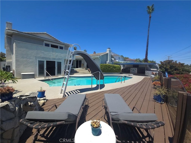 5726 Sunmist Dr, Rancho Palos Verdes, CA 90275 - view of swimming pool featuring a wooden deck and a water slide