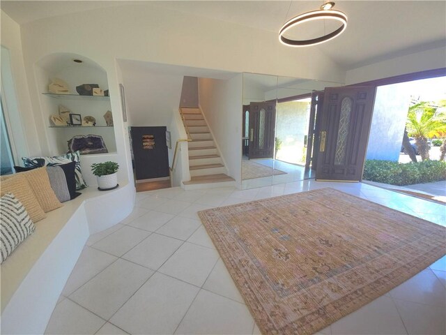 5726 Sunmist Dr, Rancho Palos Verdes, CA 90275 - foyer entrance featuring vaulted ceiling, tile patterned flooring, and stairs