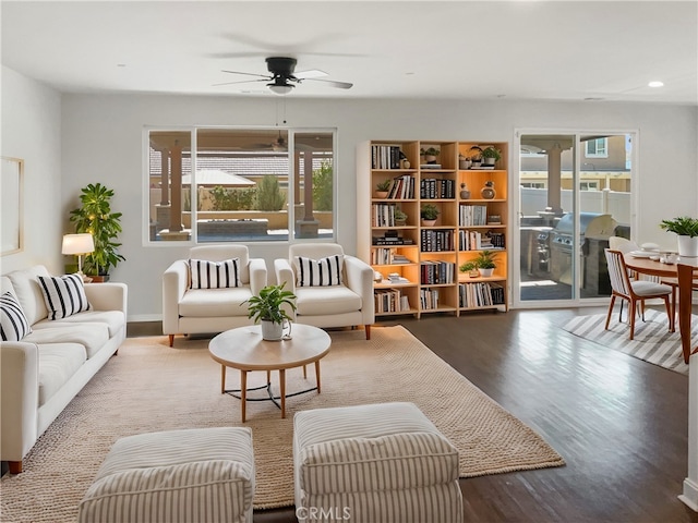 living area featuring ceiling fan and wood finished floors