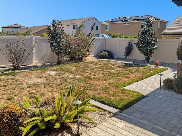 view of yard with a residential view and a fenced backyard