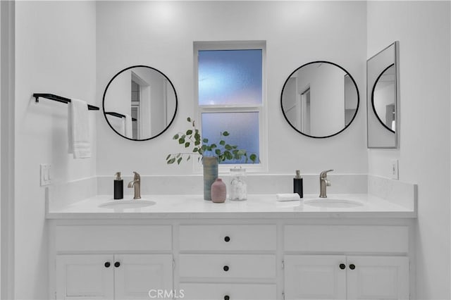 bathroom with double vanity and a sink