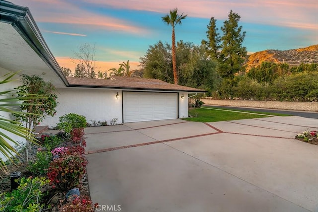 garage featuring driveway