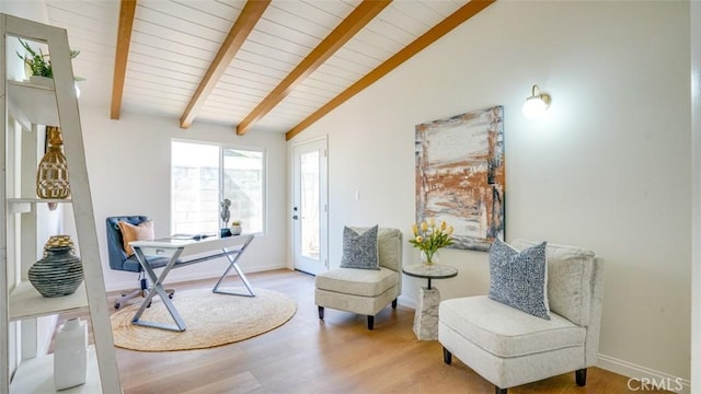 office space with lofted ceiling with beams, wooden ceiling, baseboards, and wood finished floors