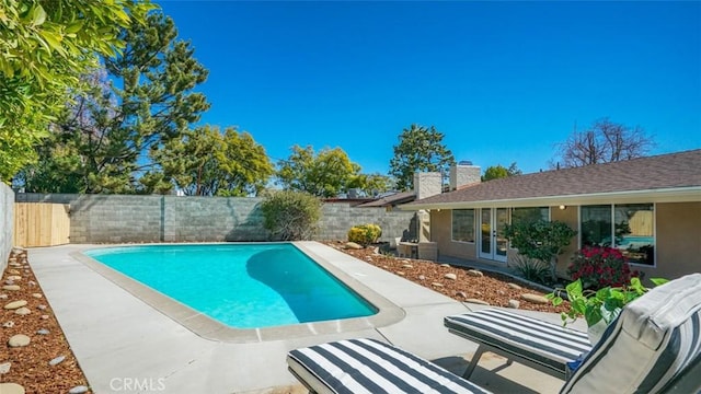 view of pool with a patio, a fenced backyard, and a fenced in pool