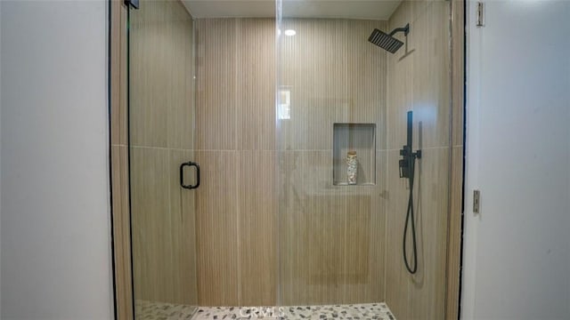 full bath featuring a shower stall