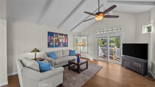 living room with baseboards, a ceiling fan, dark wood-style floors, high vaulted ceiling, and beam ceiling