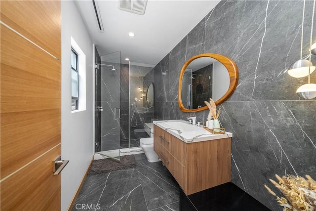 full bathroom featuring toilet, visible vents, vanity, marble finish floor, and a stall shower