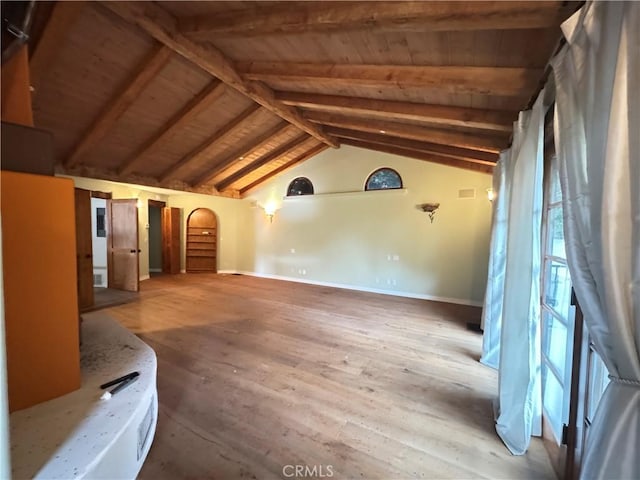 additional living space with vaulted ceiling with beams, wood finished floors, wood ceiling, and baseboards