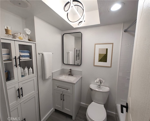 bathroom featuring visible vents, baseboards, toilet, shower / tub combination, and vanity