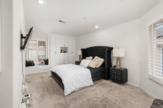 bedroom featuring recessed lighting, baseboards, visible vents, and light colored carpet