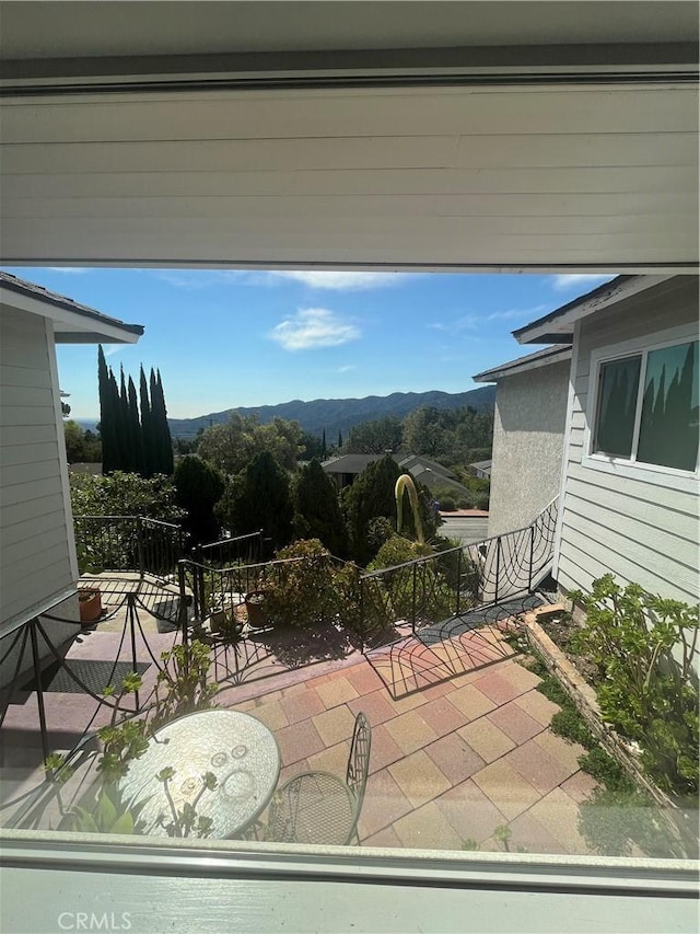 view of patio / terrace with a mountain view