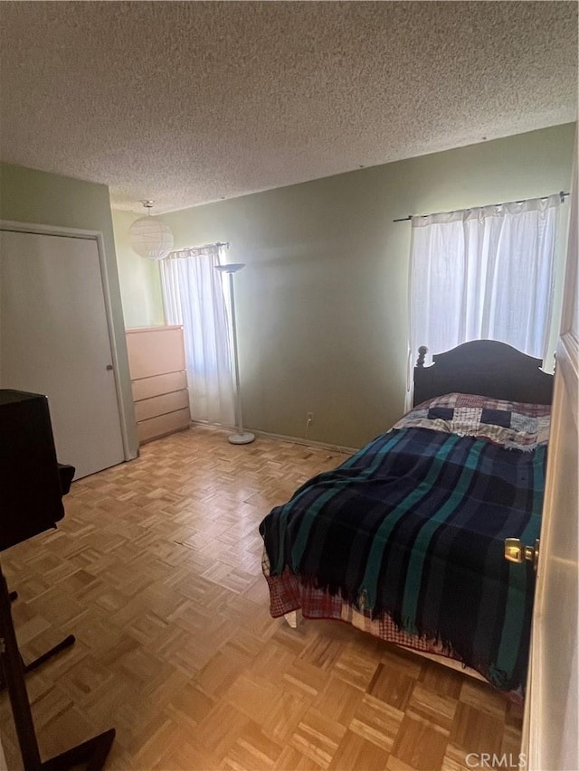 bedroom featuring a textured ceiling