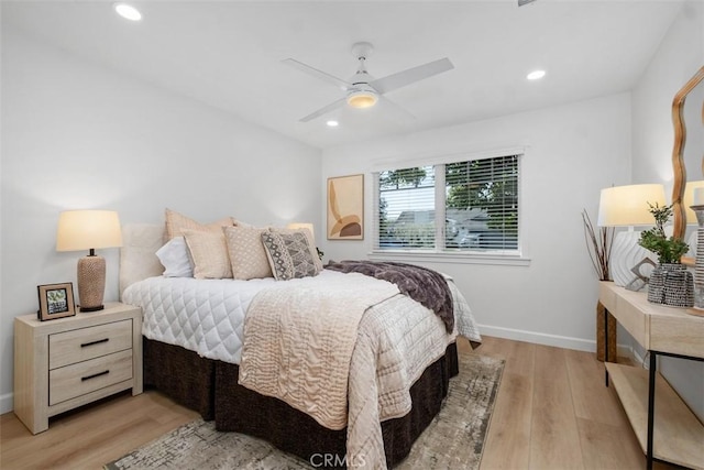 bedroom with recessed lighting, light wood-type flooring, a ceiling fan, and baseboards