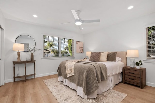 bedroom with light wood-style flooring, baseboards, a ceiling fan, and recessed lighting