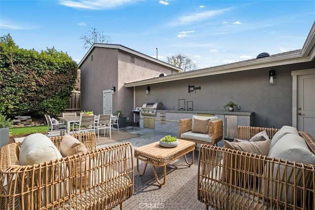 view of patio / terrace with outdoor dining space, area for grilling, and fence
