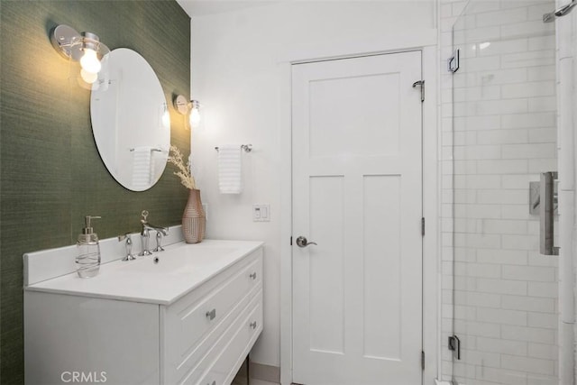 bathroom featuring an enclosed shower and vanity