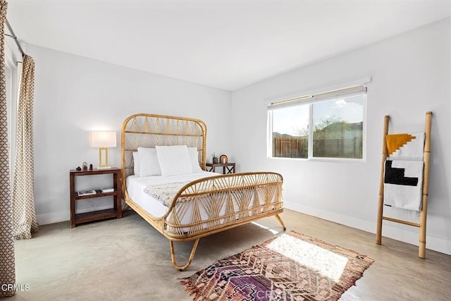 bedroom featuring baseboards