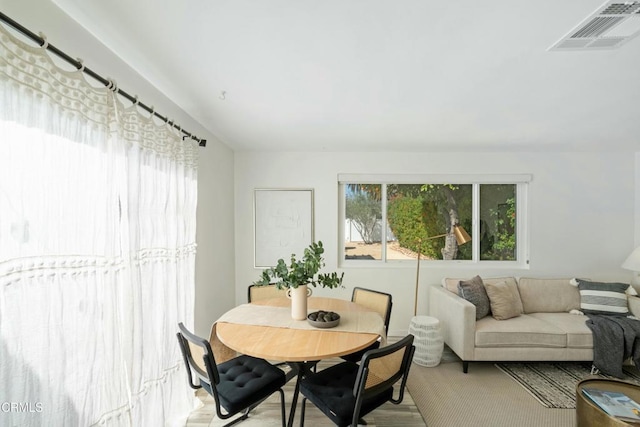 dining space featuring visible vents