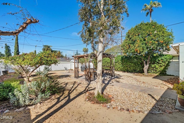 view of yard featuring a fenced backyard and a pergola