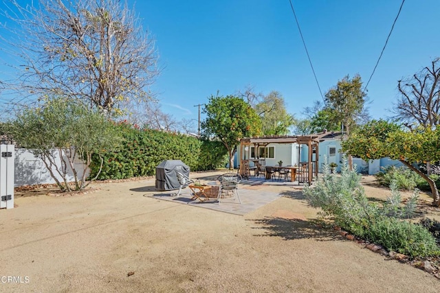 view of patio / terrace featuring a grill and a pergola