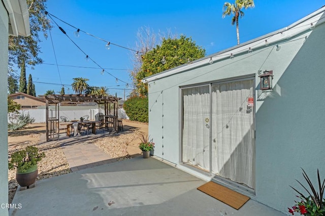 surrounding community featuring a patio area, fence, and a pergola