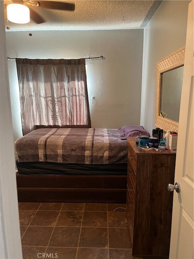 201 W Raymond St, Compton, CA 90220 - bedroom featuring a ceiling fan and a textured ceiling