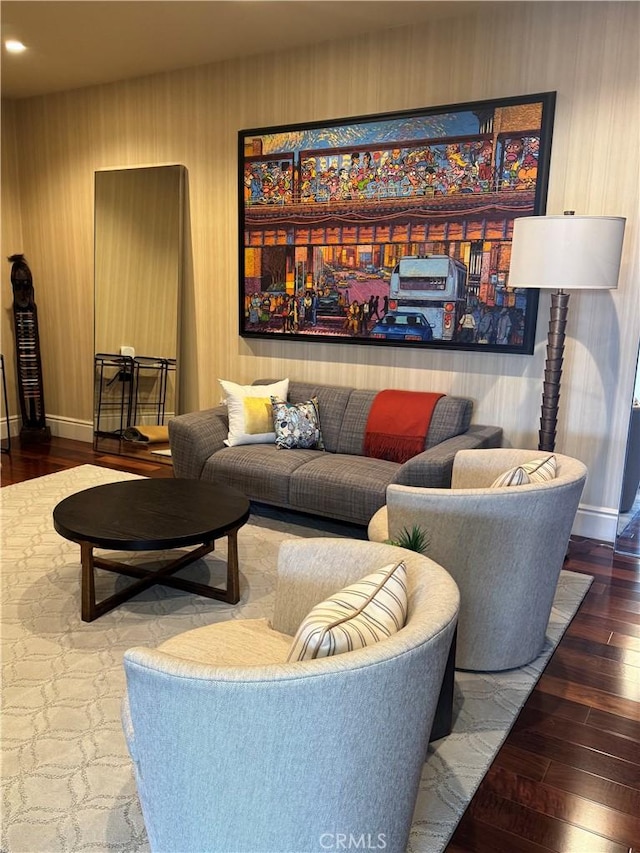 living room featuring baseboards and wood finished floors