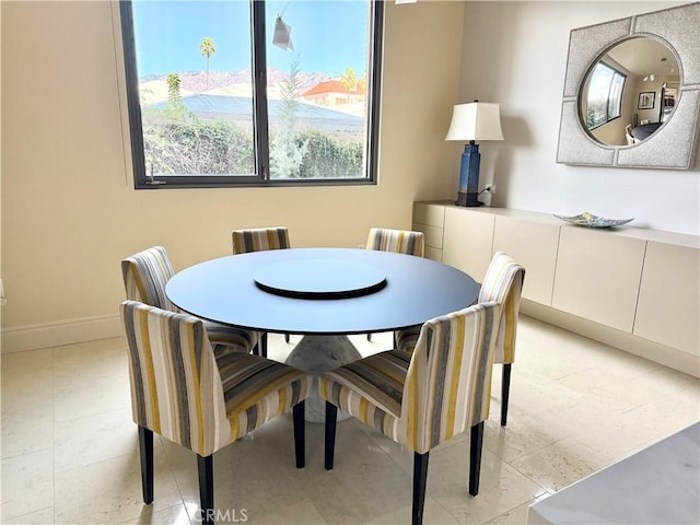 dining room with baseboards