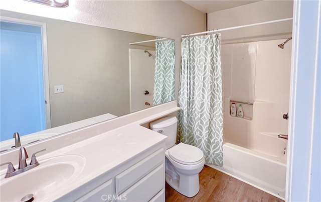 40661 169th St E, Lancaster, CA 93535 - bathroom featuring vanity, shower / tub combo with curtain, toilet, and wood finished floors