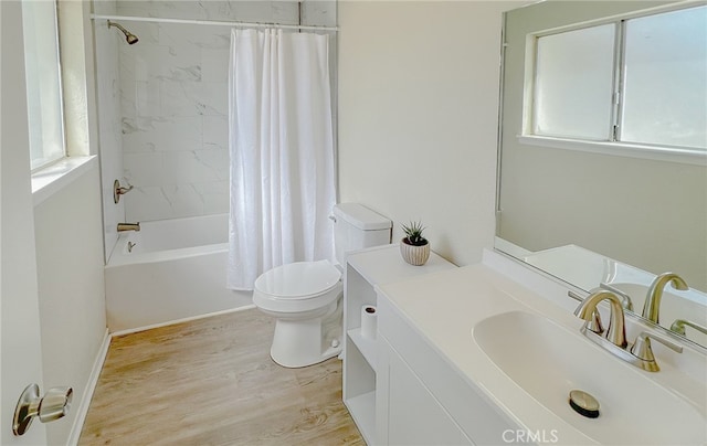 40661 169th St E, Lancaster, CA 93535 - full bath with toilet, vanity, wood finished floors, and shower / bath combo with shower curtain