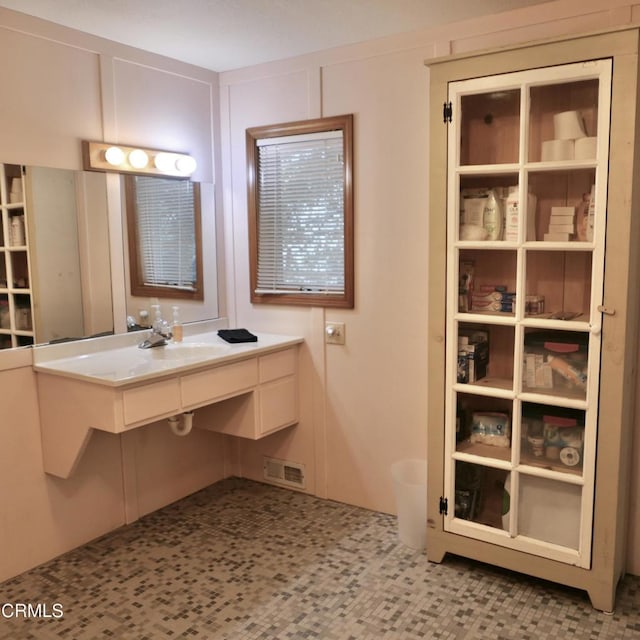 bathroom with visible vents and vanity