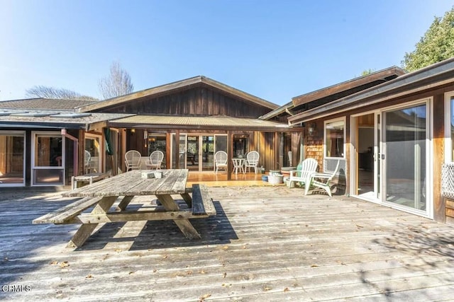 wooden deck with outdoor dining area