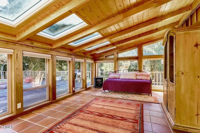 bedroom featuring tile patterned floors, wood ceiling, access to exterior, and lofted ceiling with skylight