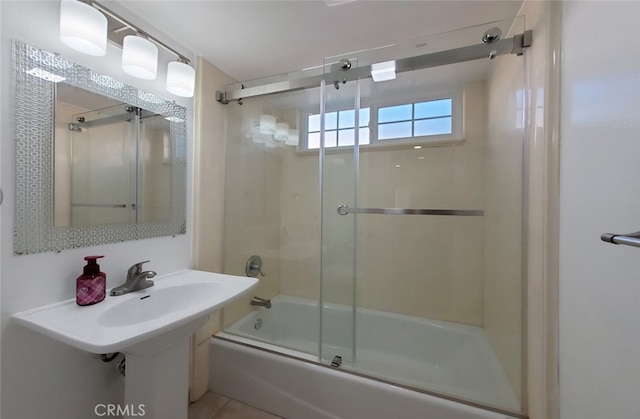 full bath featuring combined bath / shower with glass door