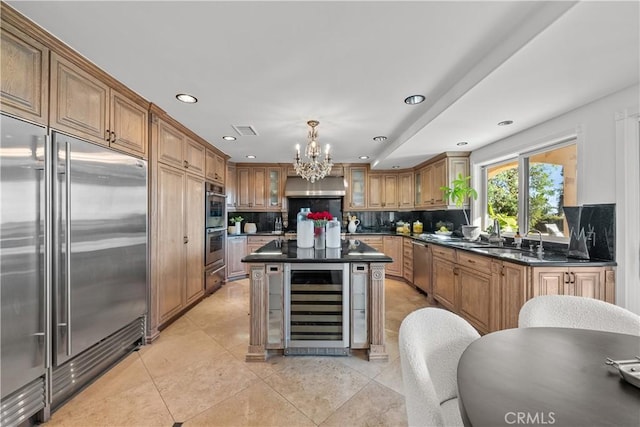 kitchen with wine cooler, glass insert cabinets, hanging light fixtures, stainless steel appliances, and a notable chandelier