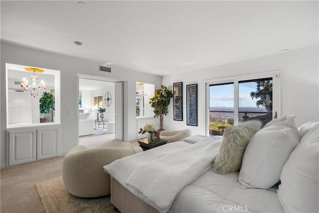 bedroom featuring a chandelier, light carpet, and visible vents