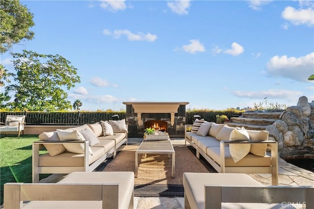 view of patio / terrace featuring an outdoor living space with a fireplace