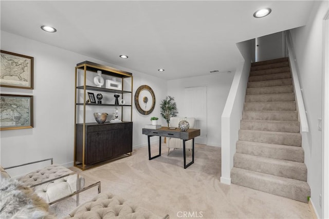 office space with baseboards, recessed lighting, and light colored carpet